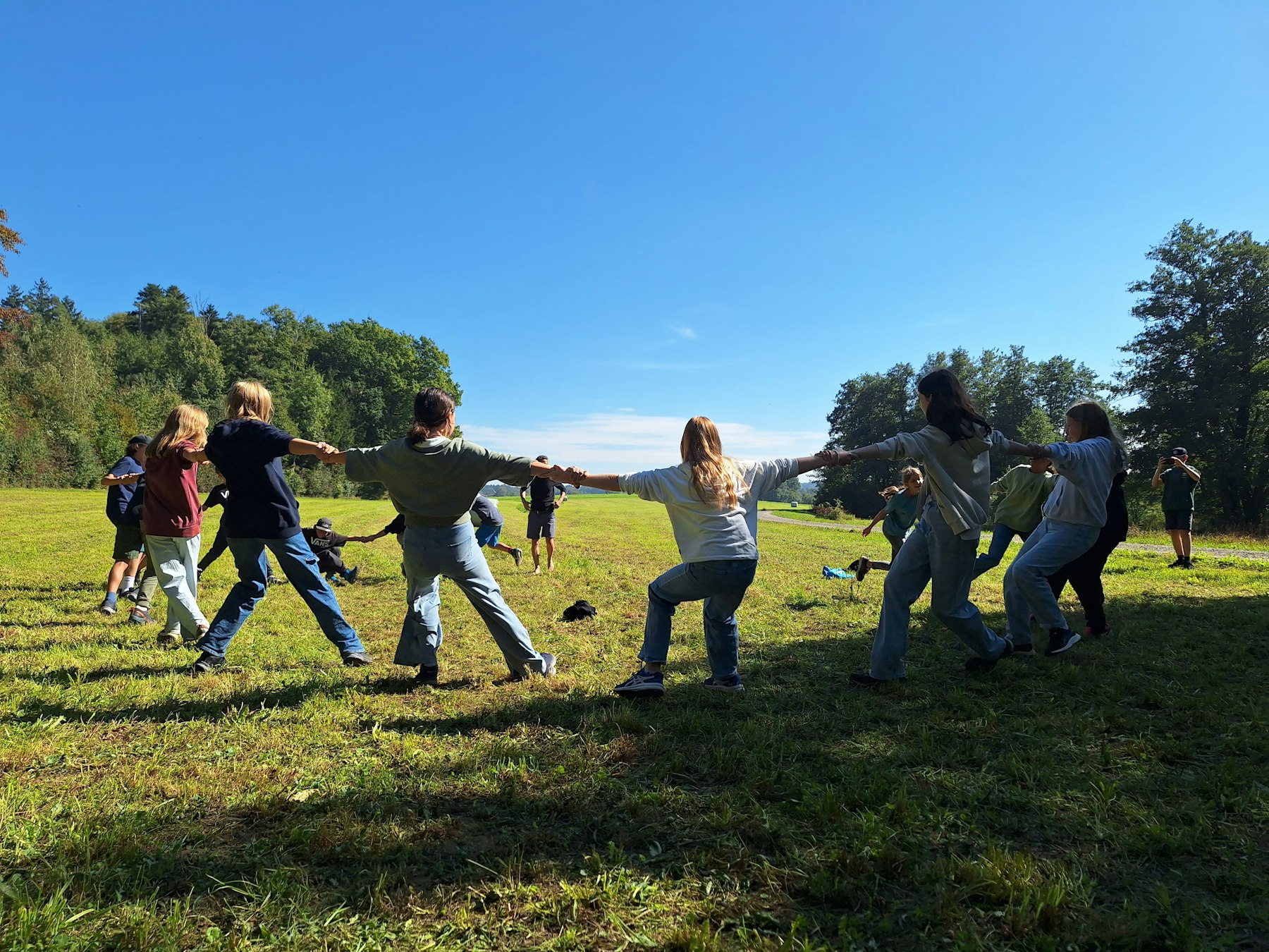 Children playing together in a grassy field